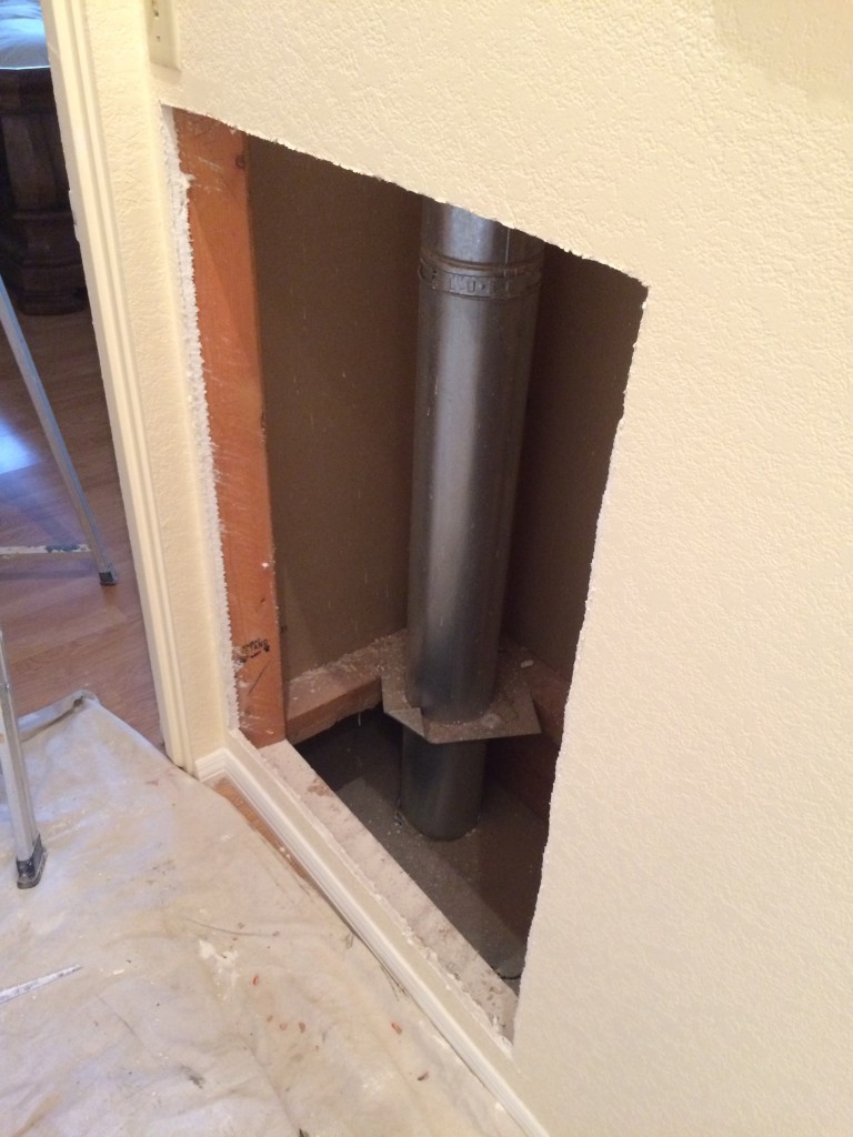 Tearing open our hallway wall